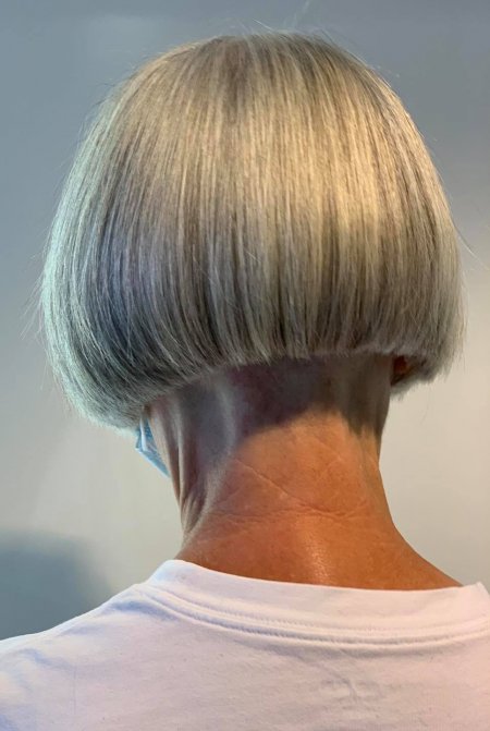 Bob cut from behind on a lady with a white tshirt and grey hair at the klinik salon London