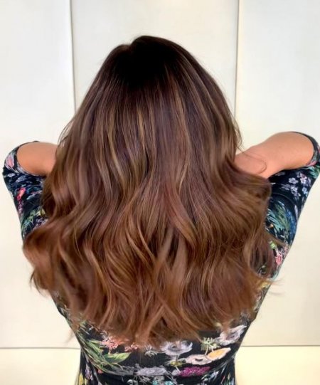 Girl with long tousled waves as an colour melt ombre done by Anna at the klinik salon London
