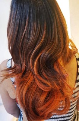 Brown hair that has been coloured with a copper balayage at the klinik salon London