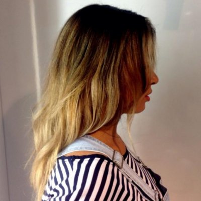 Hair has been coloured using baliage technique to create depth to blonde tips.