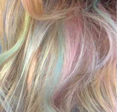 On a blonde base, Leyla has added rainbow colours  to create an interest 