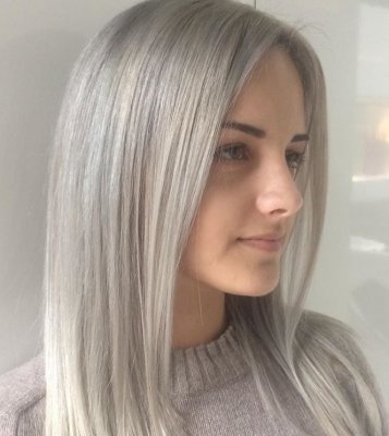 Platinum blonde hair being coloured to achieve a root shadow to give a softer regrowth in the future, by Thea at the klinik salon London