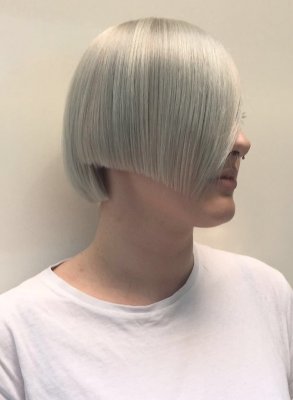 A sharp cut has been done leaving the fringe area long. Hair has been pre lightened and toned to an icy finished tone. Done by Mark at the klinik London