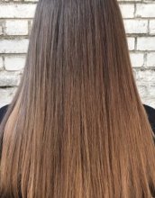 Hair has been coloured into a soft subtle balayage using tones of beige blond to not get any harsh lines. 