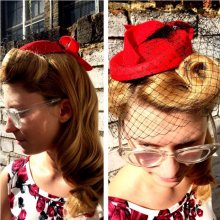 To put hair up with Victoria rolls at tghe fron to create a retro look 