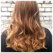 Hair has been coloured in natural tones to give a very subtle balayage